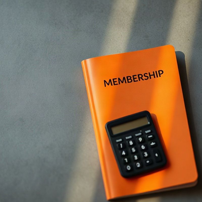 Kenyan Sacco membership booklet and a calculator on a slate-grey desk